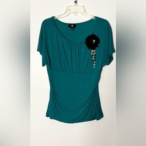 IZ Byer stretchy teal green/black blouse/flower with beading. Size XL.